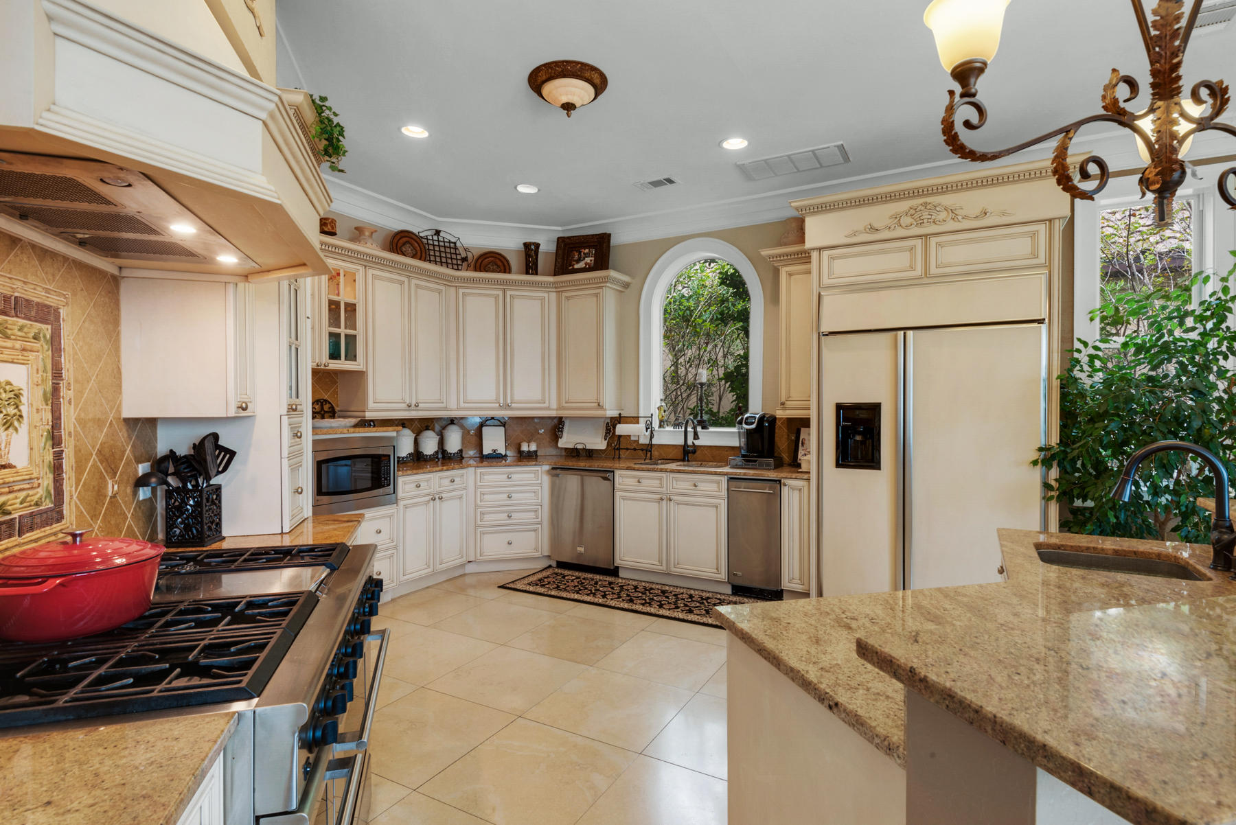 1239 Driftwood Point Road Santa Rosa Beach, FL 32459 - Photo 20 of 66 a kitchen with stainless steel appliances granite countertop a stove a refrigerator a sink and white cabinets with wooden floor