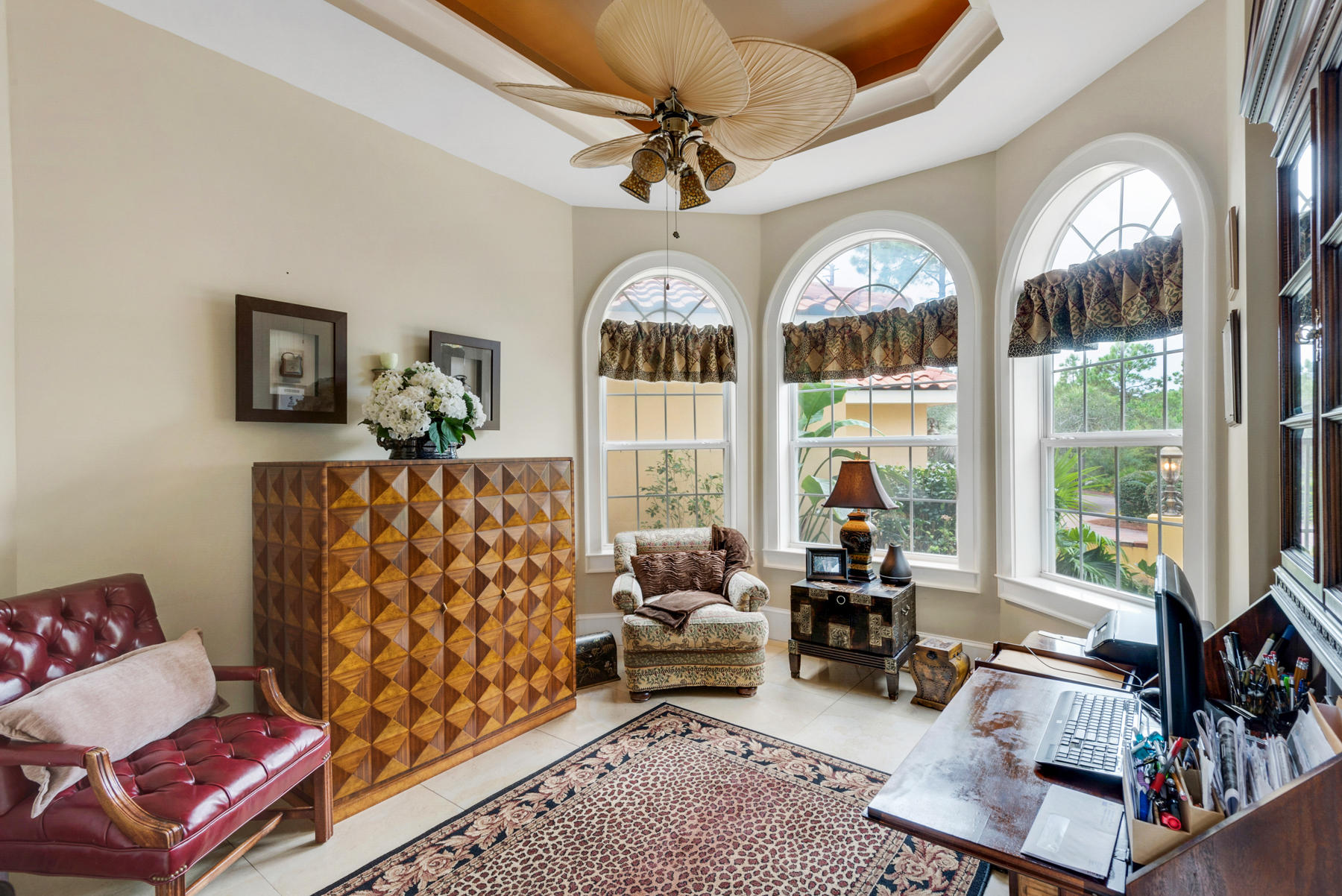 1239 Driftwood Point Road Santa Rosa Beach, FL 32459 - Photo 32 of 66 a living room with furniture a fireplace and a chandelier