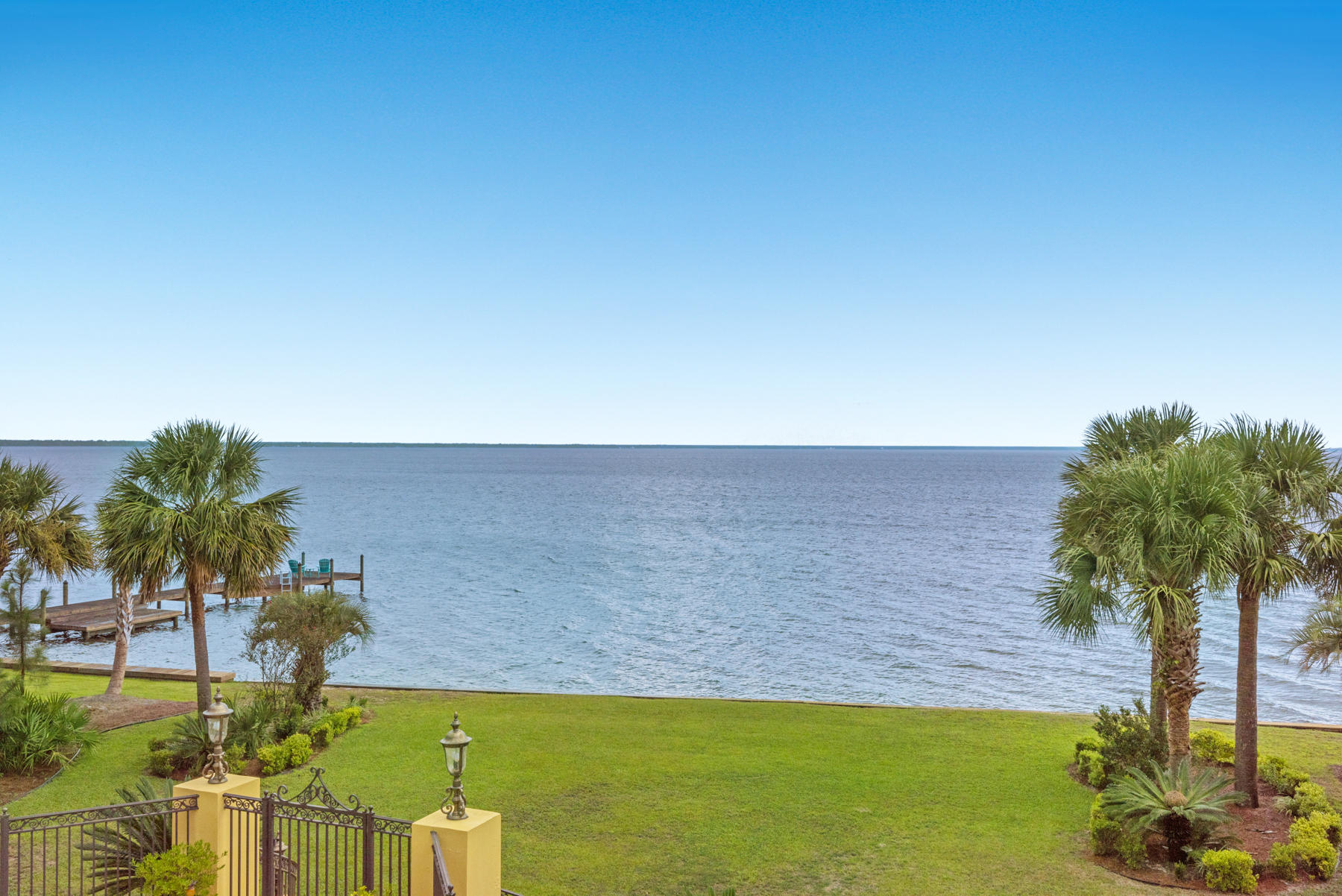 1239 Driftwood Point Road Santa Rosa Beach, FL 32459 - Photo 58 of 66 a view of a lake with a building in the background