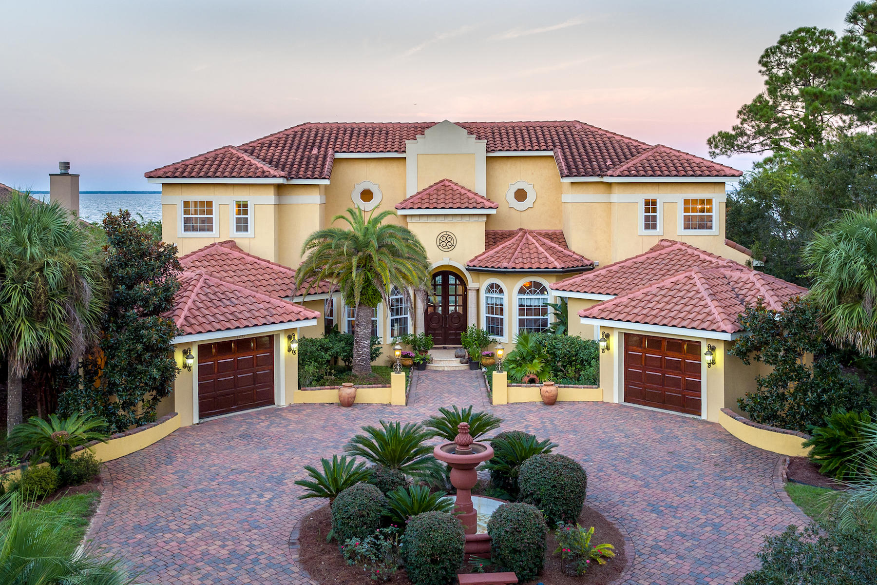 1239 Driftwood Point Road Santa Rosa Beach, FL 32459 - Photo 66 of 66 a front view of a house with a yard and garage