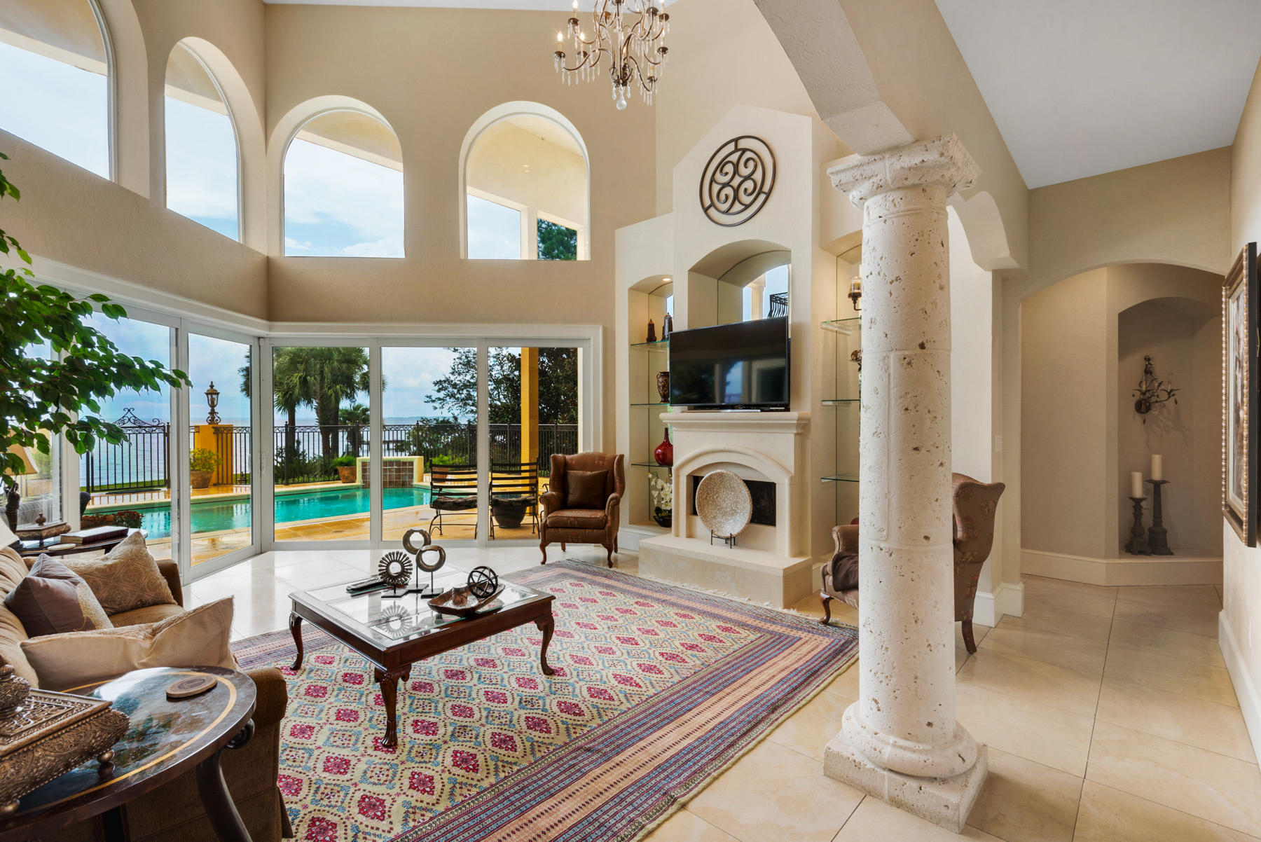 1239 Driftwood Point Road Santa Rosa Beach, FL 32459 - Photo 8 of 66 a living room with fireplace furniture and a large window