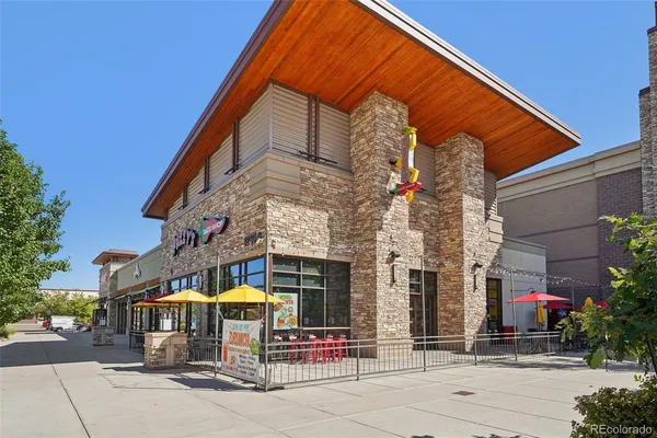 a view of a building with sitting area