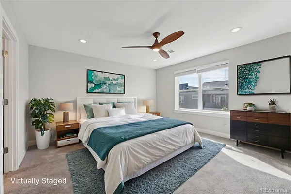 a spacious bedroom with a large bed and a window