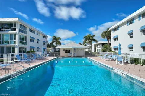 a view of a swimming pool with a patio