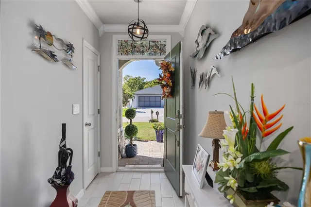 a view of a dining room with furniture and chandelier