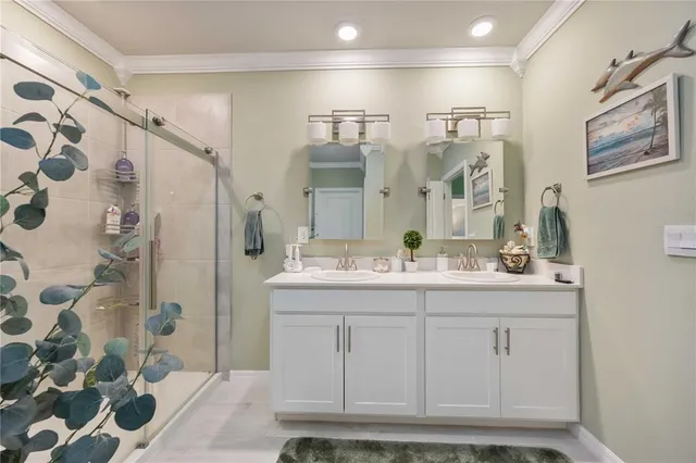 a vase with flowers sitting on a table in front of a house