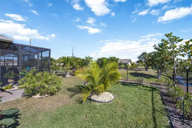 an aerial view of a house with yard swimming pool and outdoor seating