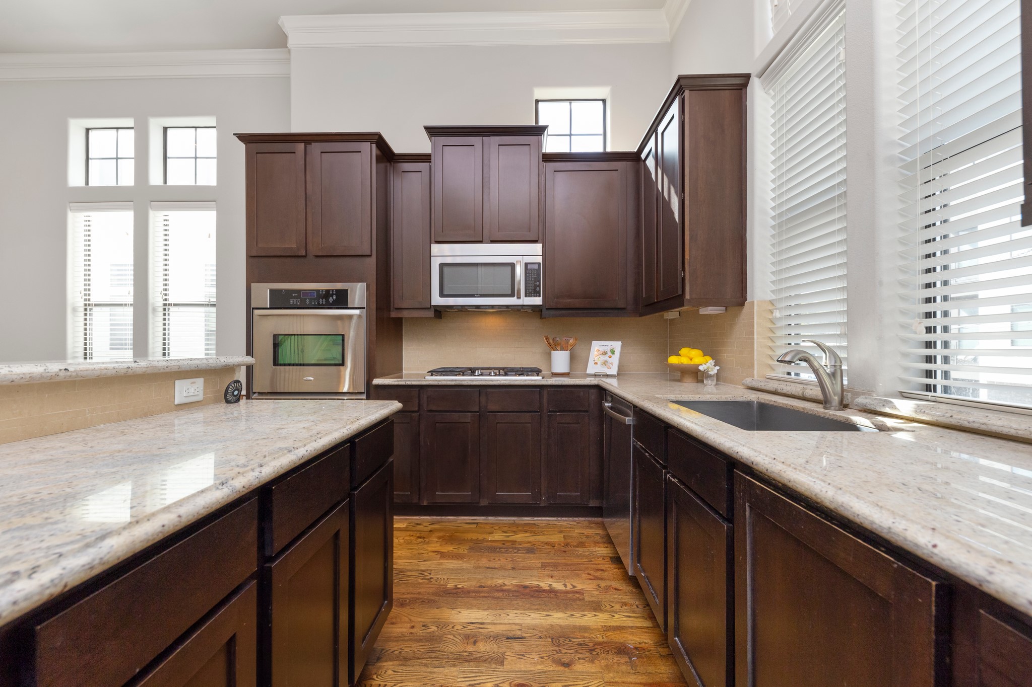 1406 Hickory Street Houston, TX 77007 - Photo 24 of 41 a kitchen with stainless steel appliances granite countertop a sink stove and cabinets