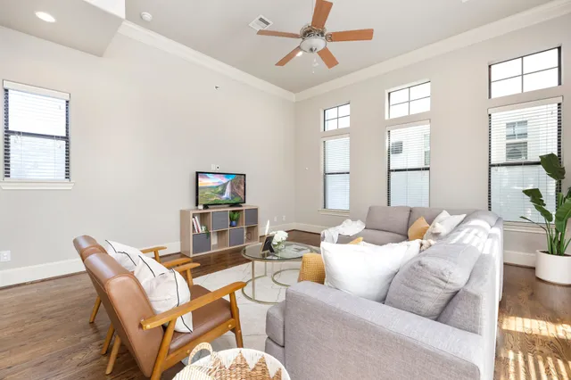 a living room with furniture and a window