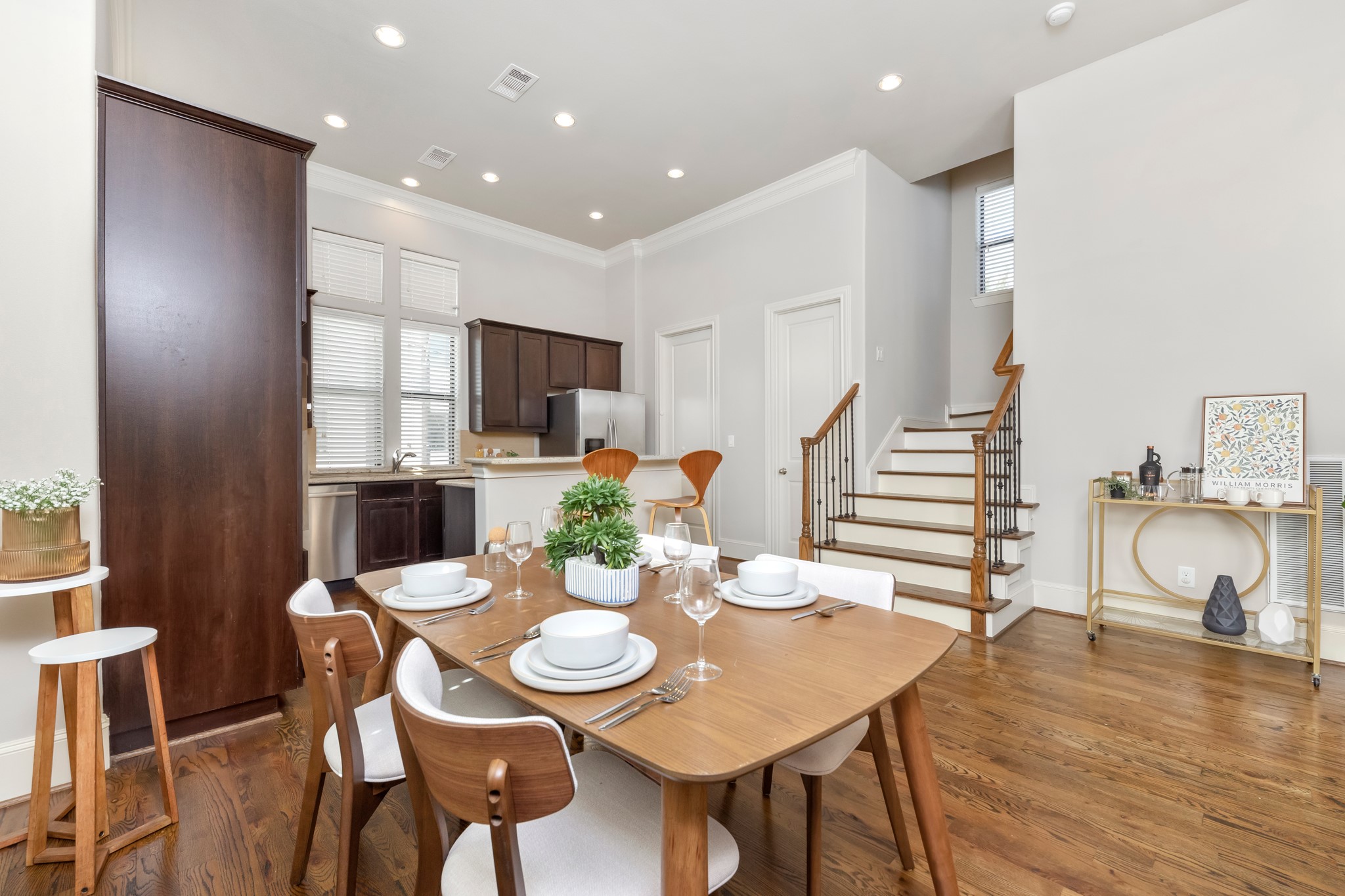 1406 Hickory Street Houston, TX 77007 - Photo 32 of 41 a view of a dining room with furniture and wooden floor