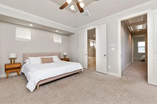 a bedroom with a bed and a lamp