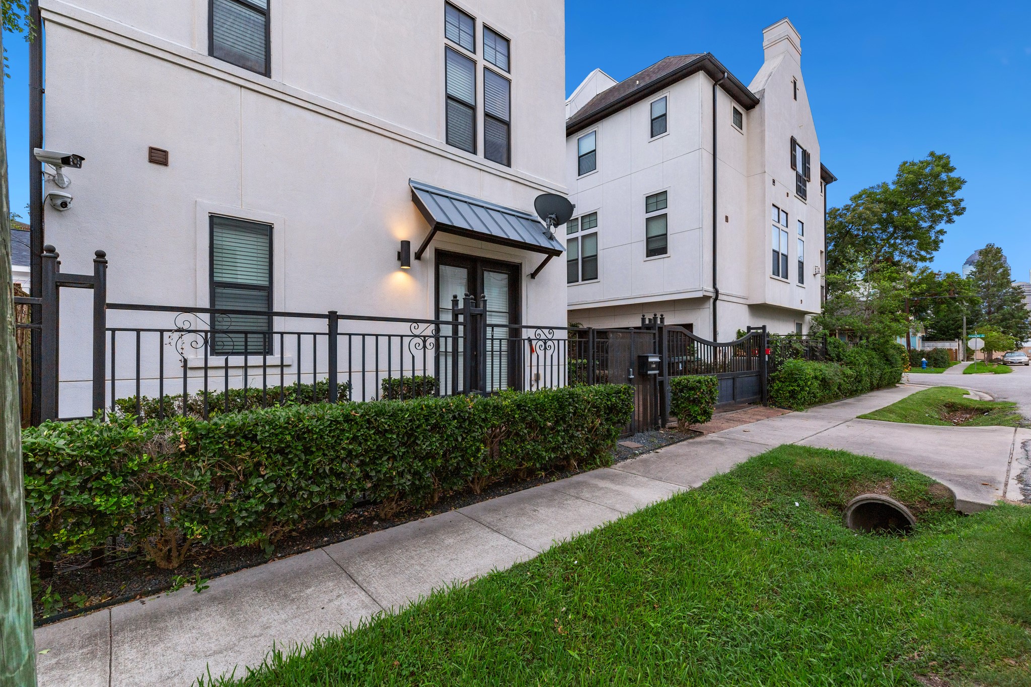 1406 Hickory Street Houston, TX 77007 - Photo 8 of 41 a view of a white house with a yard and plants