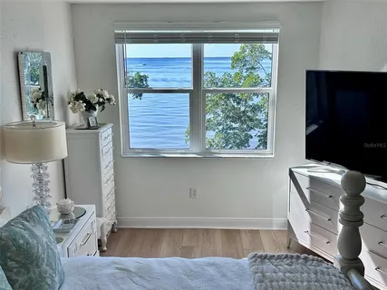 a large bathroom with double vanity and a mirror