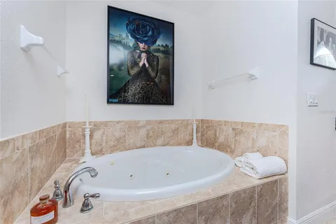 a spacious bathroom with a double vanity sink and a mirror