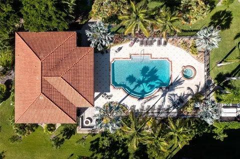 a view of a swimming pool with a table and chairs
