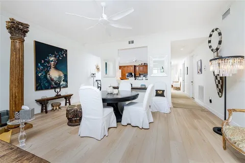 a kitchen that has a table and chairs in it