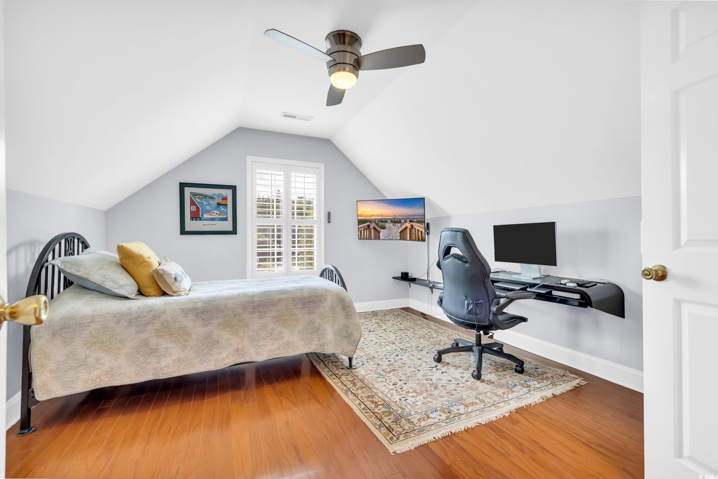 3112 Bayhaven Drive Myrtle Beach, SC 29579 - Photo 19 of 40 Bedroom with wood finished floors, ceiling fan, vaulted ceiling, and a desk