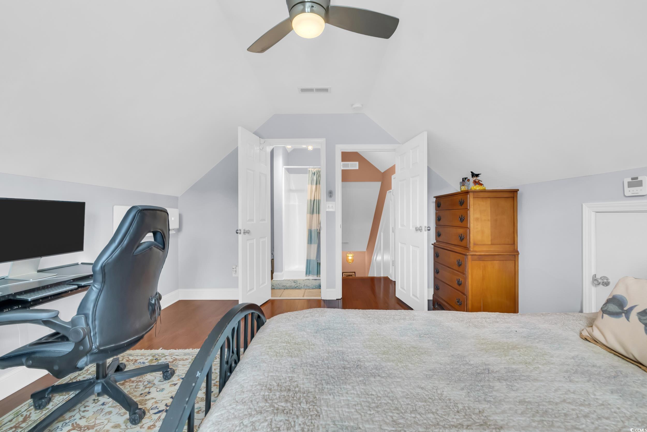 3112 Bayhaven Drive Myrtle Beach, SC 29579 - Photo 20 of 40 Bedroom with dark wood-type flooring, ceiling fan, an office area, and lofted ceiling