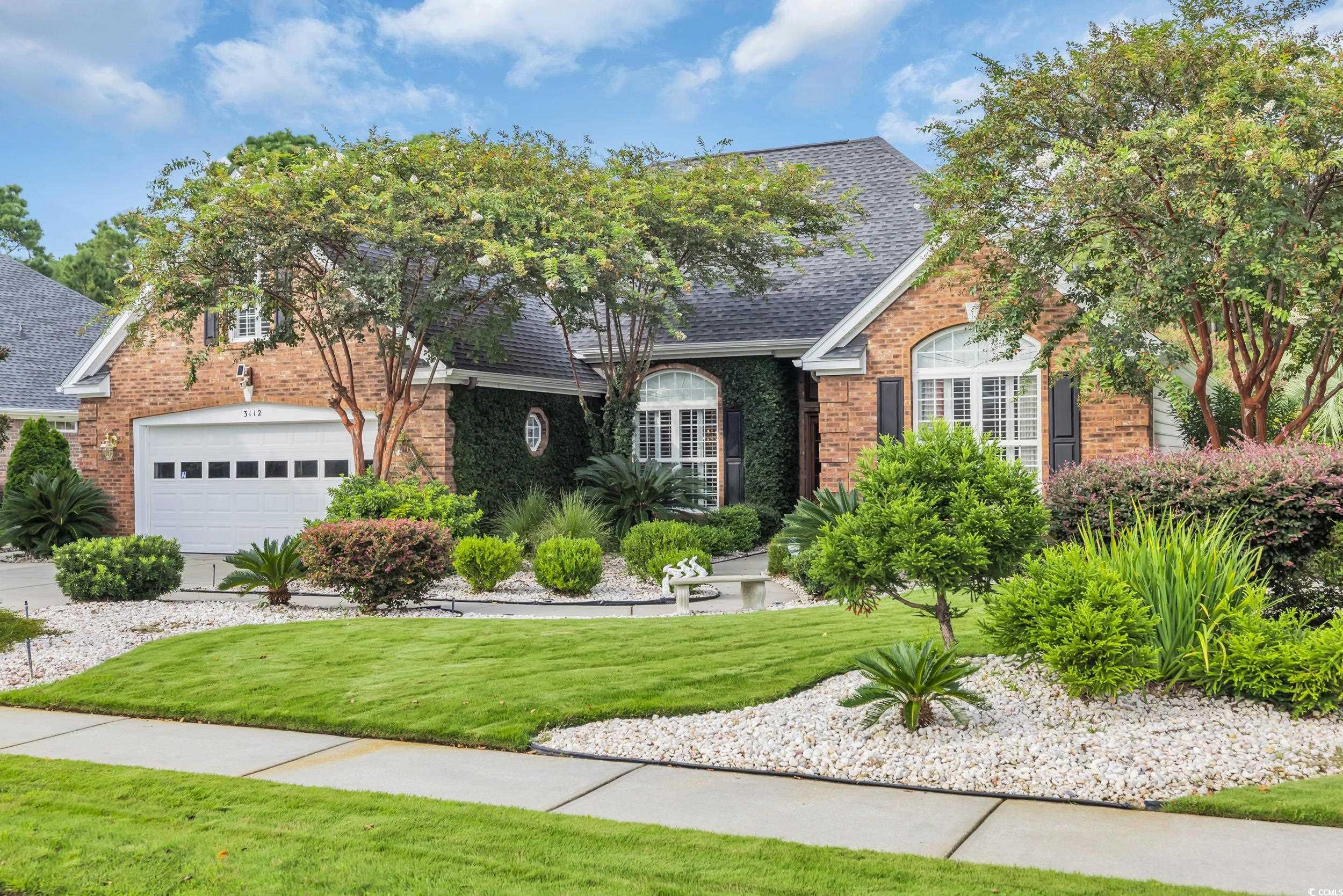 3112 Bayhaven Drive Myrtle Beach, SC 29579 - Photo 2 of 40 View of front of home with brick siding, a garage, a front yard, and roof with shingles