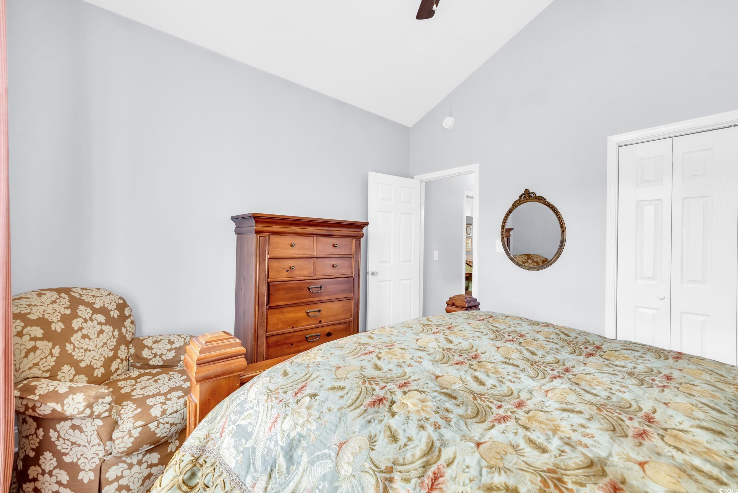 3112 Bayhaven Drive Myrtle Beach, SC 29579 - Photo 29 of 40 Bedroom featuring ceiling fan, a closet, and high vaulted ceiling