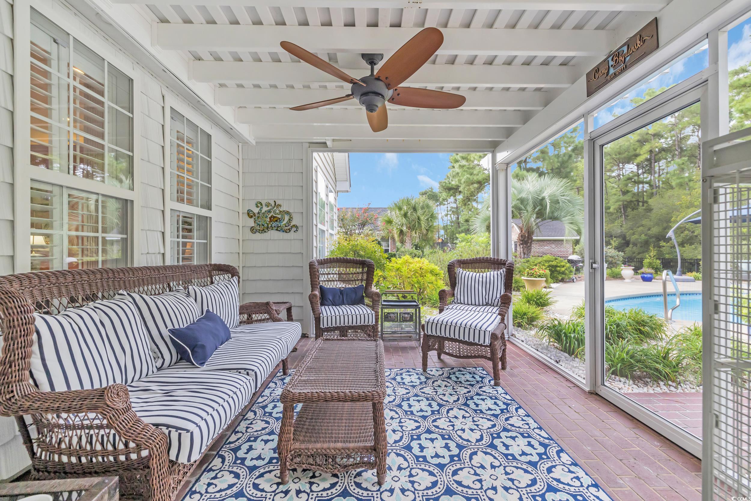 3112 Bayhaven Drive Myrtle Beach, SC 29579 - Photo 32 of 40 Sunroom with outdoor lounge area, beamed ceiling, healthy amount of natural light, ceiling fan, and a patio