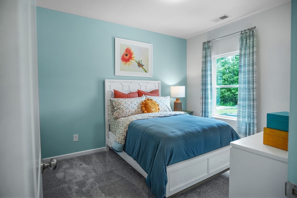 128 Ironhorse Way Dickson, TN 37055 - Photo 13 of 37 a bedroom with a bed and window