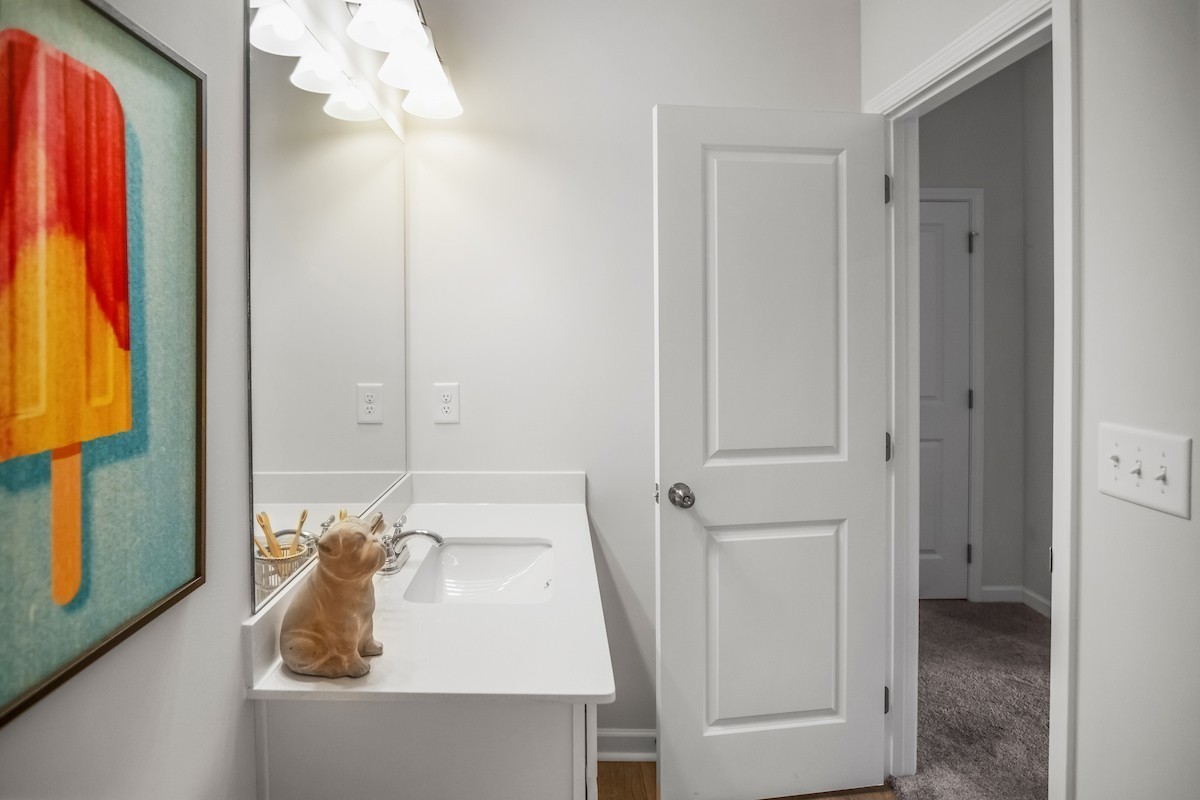 128 Ironhorse Way Dickson, TN 37055 - Photo 15 of 37 a bathroom with a sink and a mirror