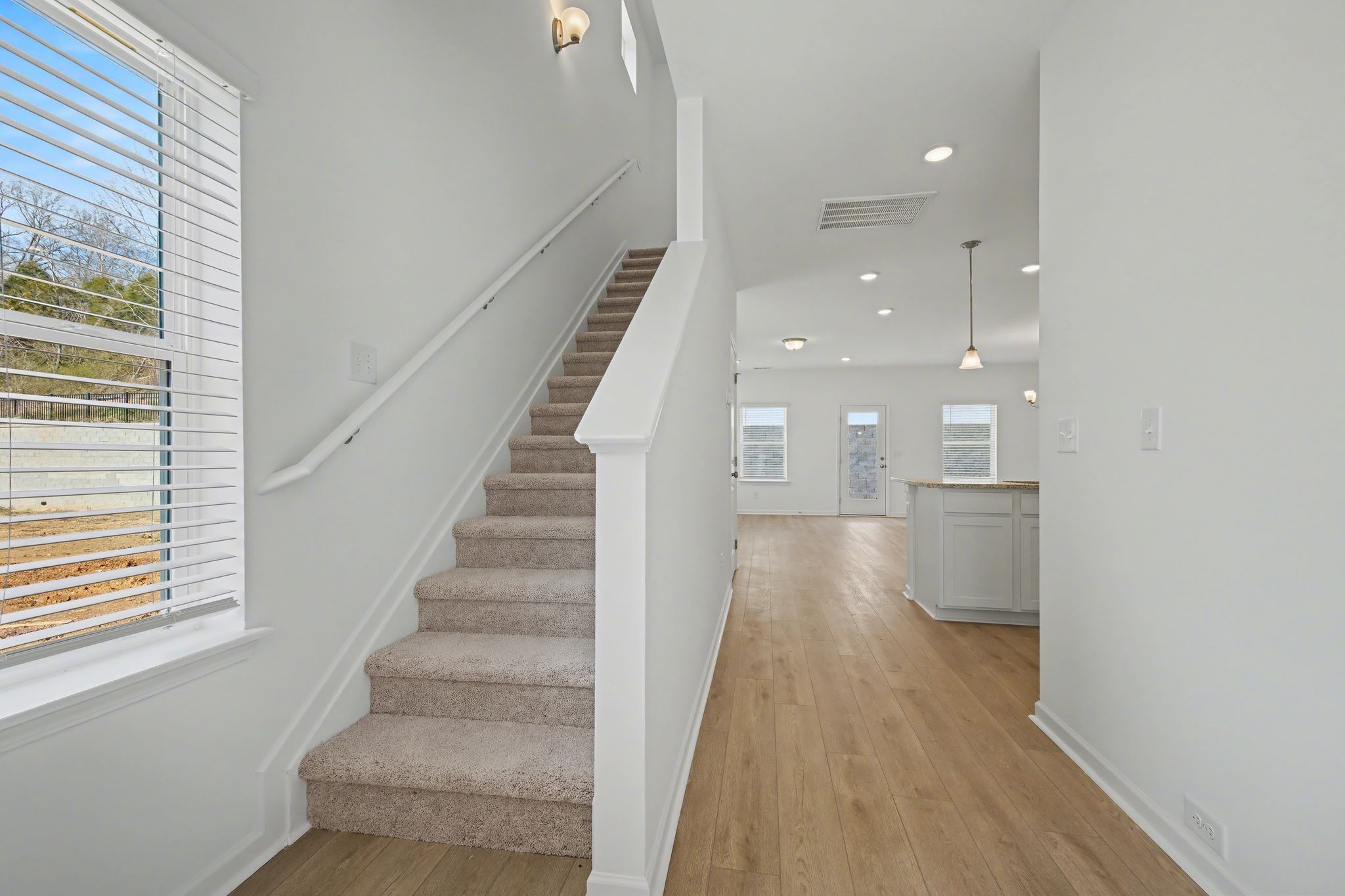 128 Ironhorse Way Dickson, TN 37055 - Photo 17 of 37 a view of entryway and hall with wooden floor