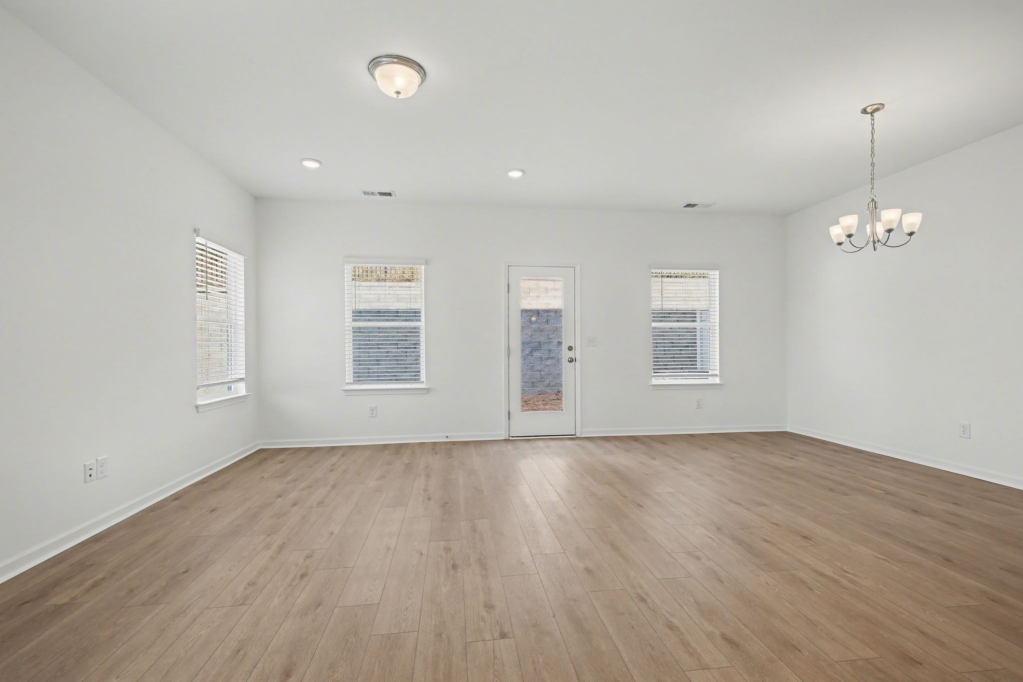 128 Ironhorse Way Dickson, TN 37055 - Photo 19 of 37 an empty room with wooden floor and windows