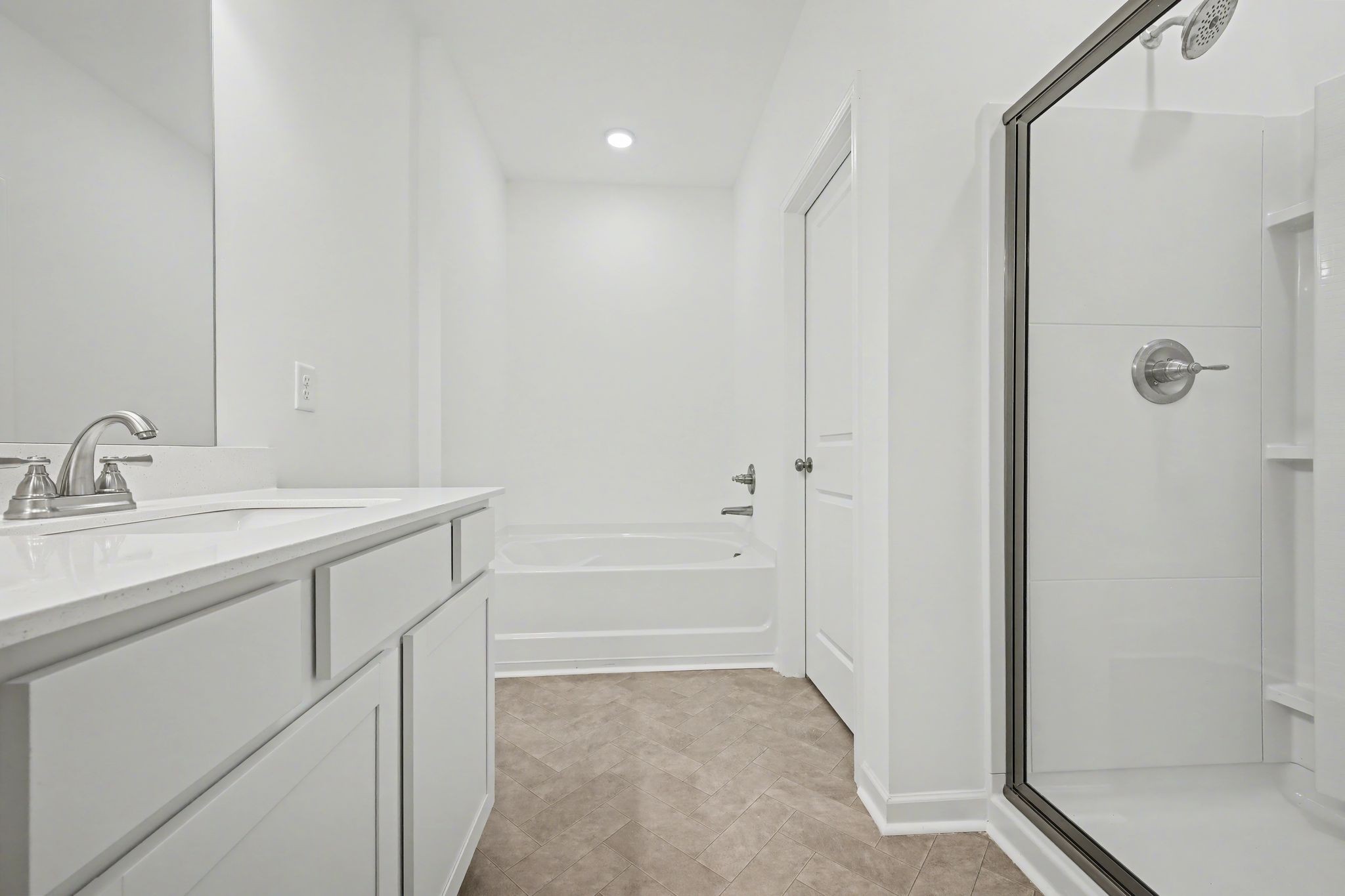 128 Ironhorse Way Dickson, TN 37055 - Photo 30 of 37 a bathroom with a granite countertop sink a mirror and a shower