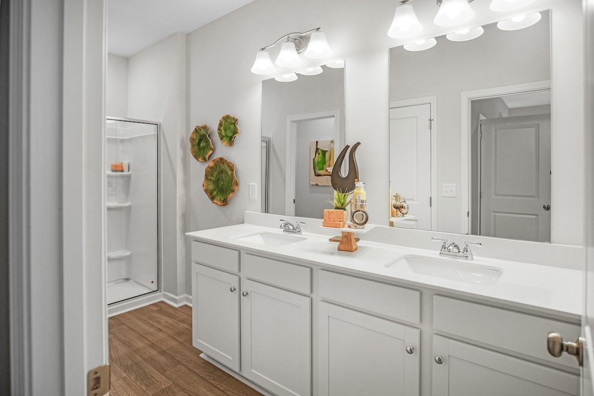 128 Ironhorse Way Dickson, TN 37055 - Photo 10 of 37 a bathroom with a sink double vanity granite and a mirror