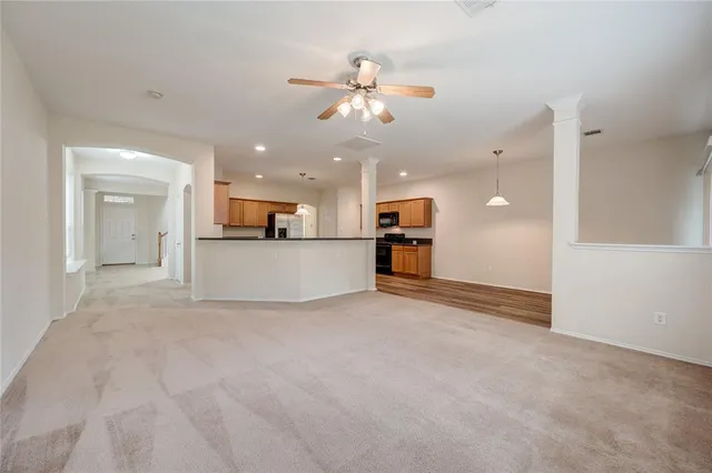 a view of a kitchen with a sink and a chandelier