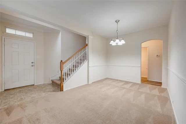 a view of an empty room with stairs