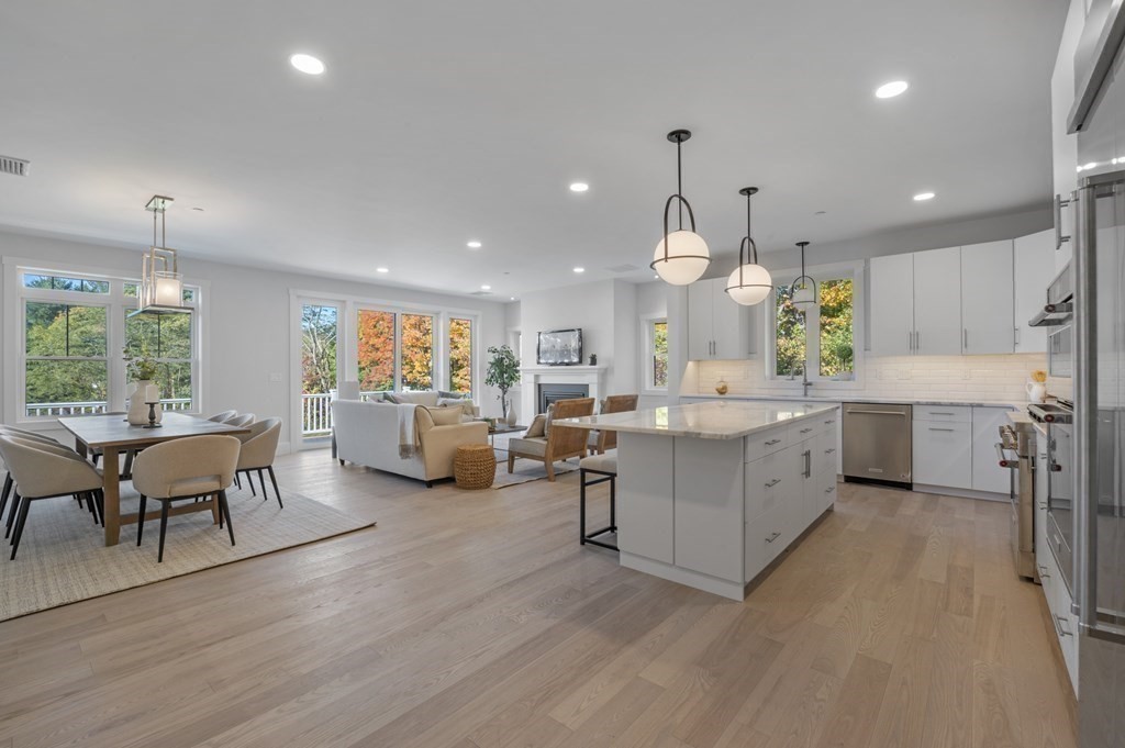 32 Pne Hl Road, Unit 32 Wenham, MA 01984 - Photo 12 of 36 a large kitchen with a table and chairs in it