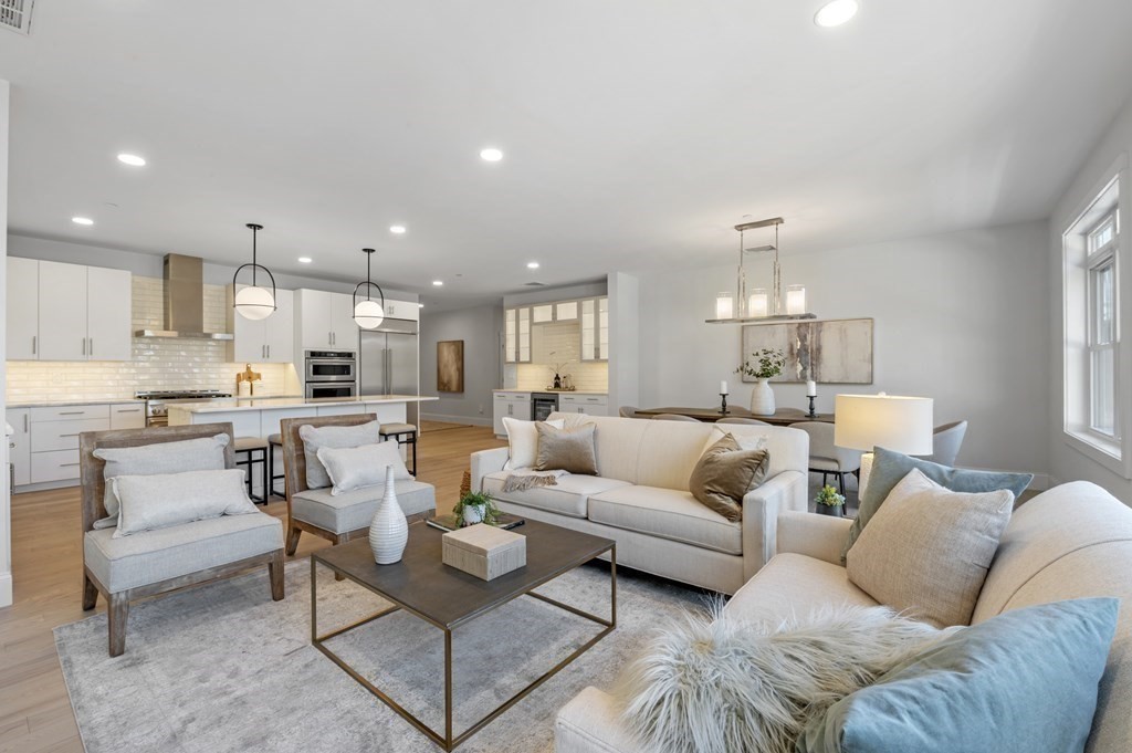 32 Pne Hl Road, Unit 32 Wenham, MA 01984 - Photo 18 of 36 a living room with furniture and kitchen view