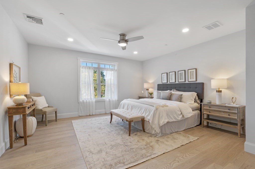 32 Pne Hl Road, Unit 32 Wenham, MA 01984 - Photo 22 of 36 a spacious bedroom with a bed and furniture