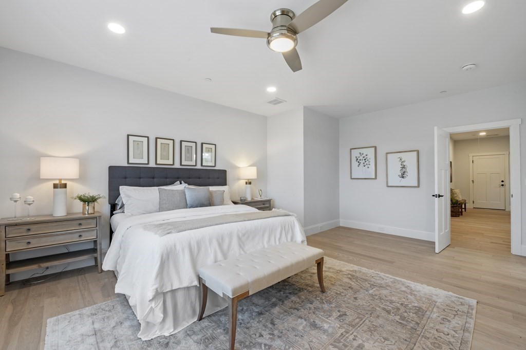 32 Pne Hl Road, Unit 32 Wenham, MA 01984 - Photo 23 of 36 a bedroom with a bed and a chandelier