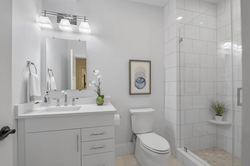 32 Pne Hl Road, Unit 32 Wenham, MA 01984 - Photo 28 of 36 a bathroom with a sink a toilet and shower