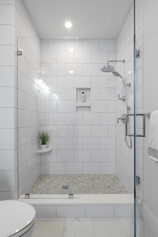 32 Pne Hl Road, Unit 32 Wenham, MA 01984 - Photo 29 of 36 a bathroom with a shower and a toilet