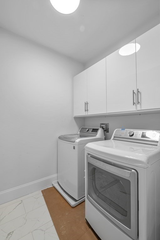 32 Pne Hl Road, Unit 32 Wenham, MA 01984 - Photo 33 of 36 a view of storage and utility room with washer and dryer