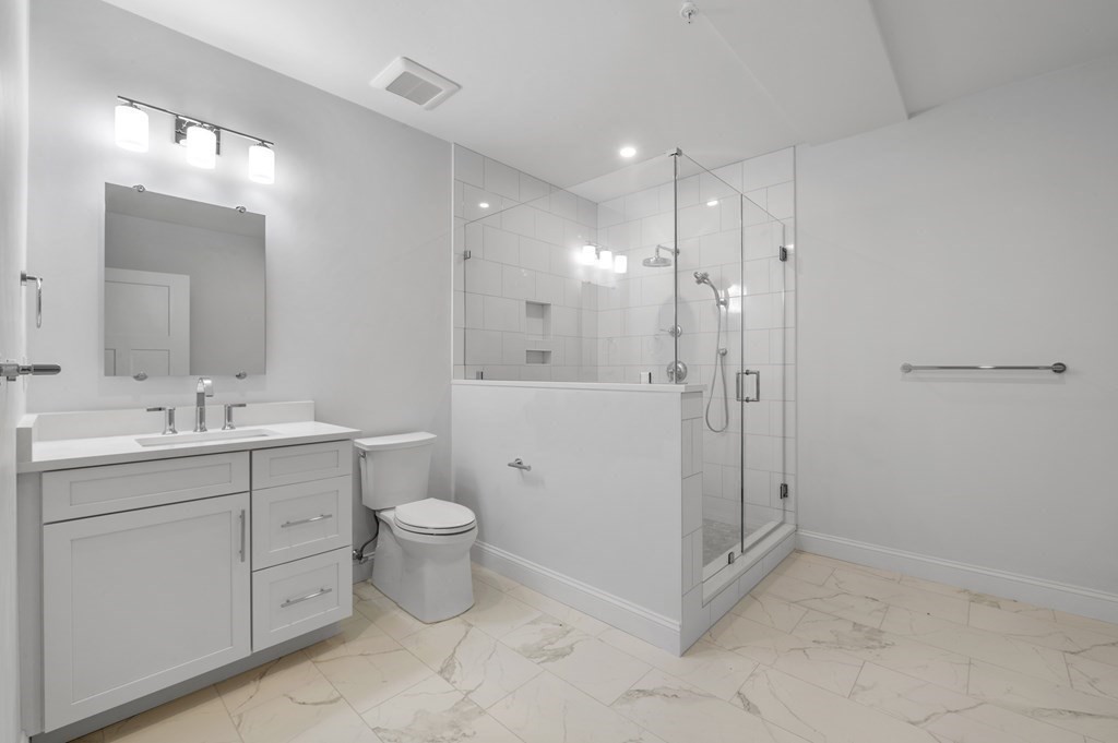 32 Pne Hl Road, Unit 32 Wenham, MA 01984 - Photo 36 of 36 a bathroom with a toilet sink and mirror