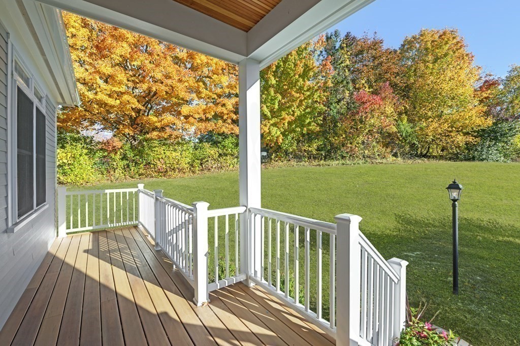 32 Pne Hl Road, Unit 32 Wenham, MA 01984 - Photo 8 of 36 a view of a deck with a yard