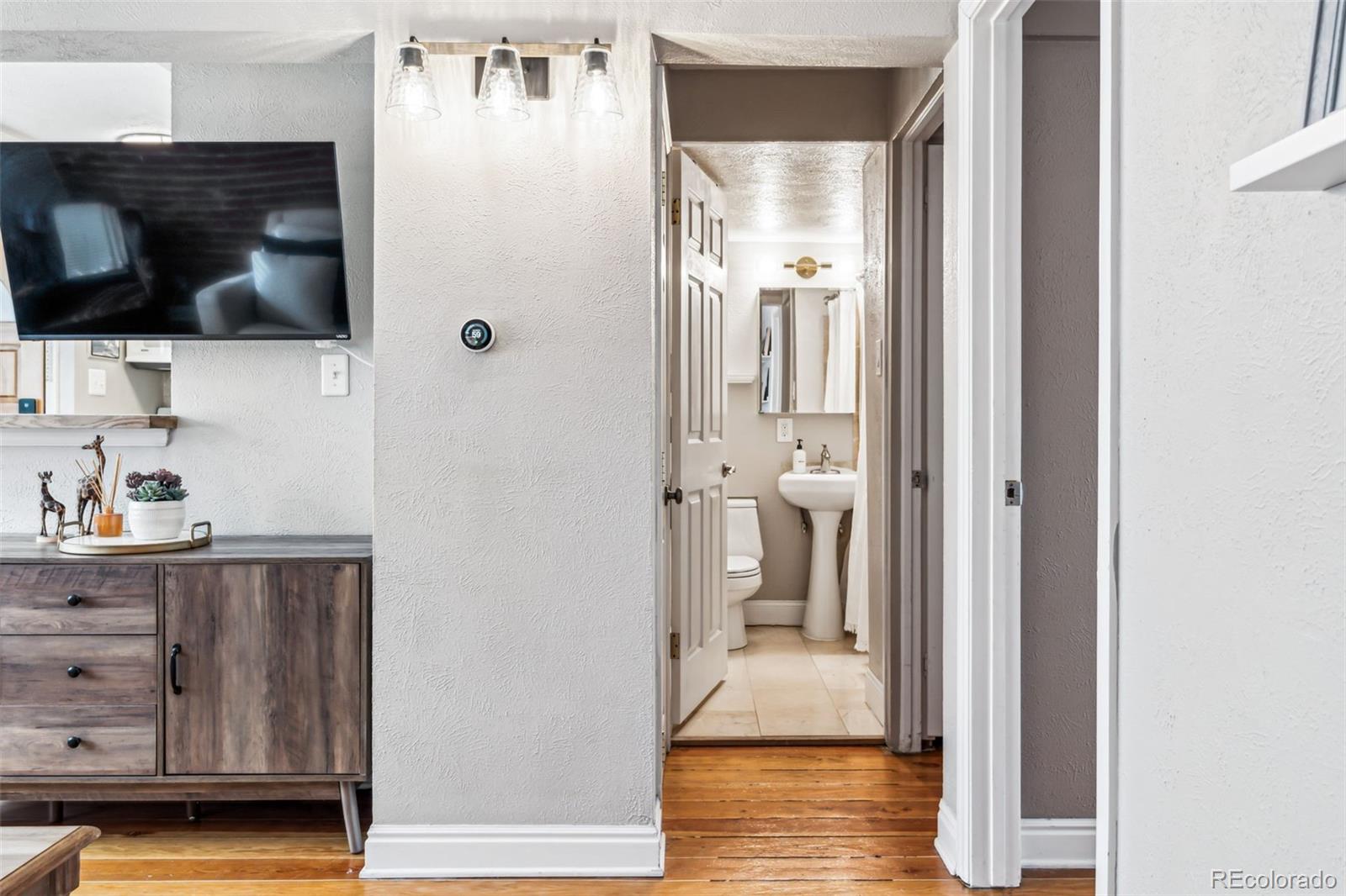 160 Jackson Street, Unit 5 Denver, CO 80206 - Photo 18 of 35 a view of a bathroom from the hallway