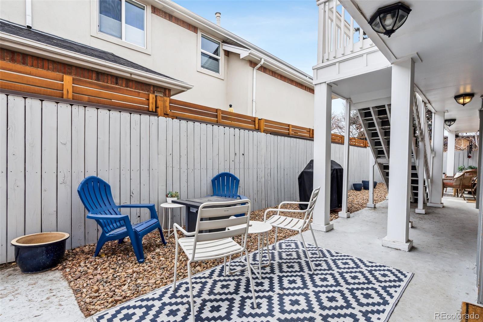 160 Jackson Street, Unit 5 Denver, CO 80206 - Photo 23 of 35 a living room with furniture and a rug