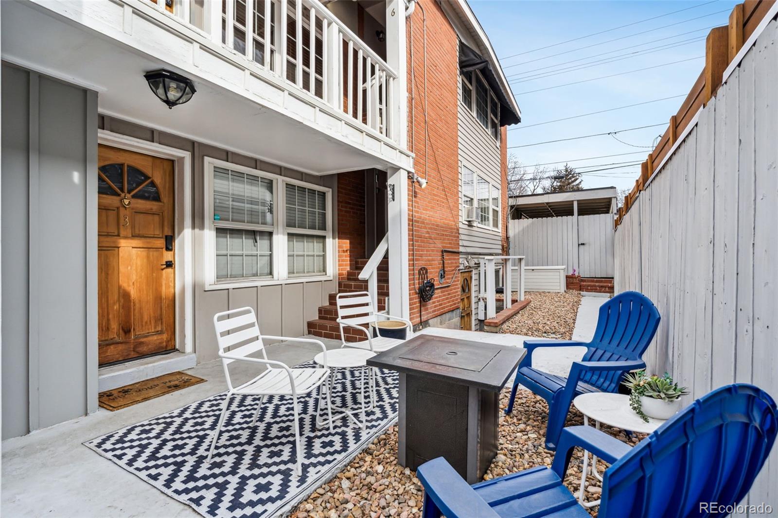 160 Jackson Street, Unit 5 Denver, CO 80206 - Photo 24 of 35 a view of a patio with couches chairs and wooden floor