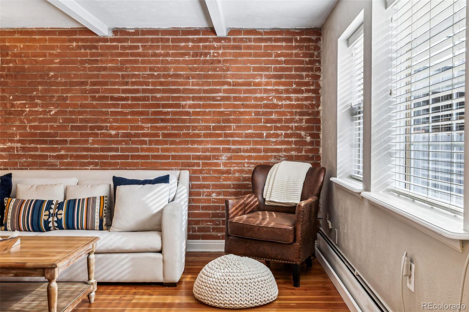 160 Jackson Street, Unit 5 Denver, CO 80206 - Photo 4 of 35 a living room with furniture and a window
