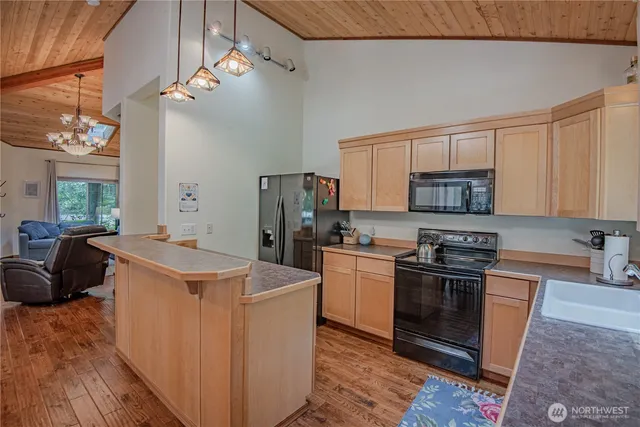 a kitchen that has a sink and a stove
