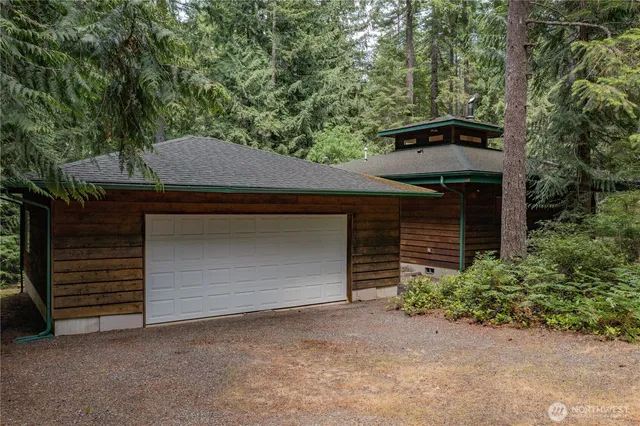 a house that has a tree in front of it