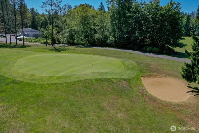 a view of a golf course with a trees
