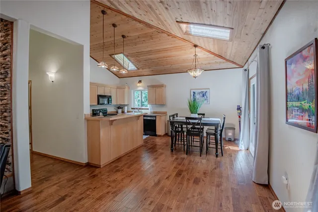 a view of a dining room with furniture window and wooden floor
